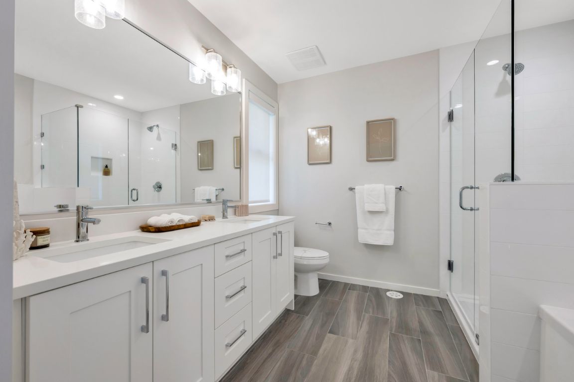 http://fox%20and%20aikins%20south%20bathroom%20featuring%20double%20sink%20shower%20and%20bathtub