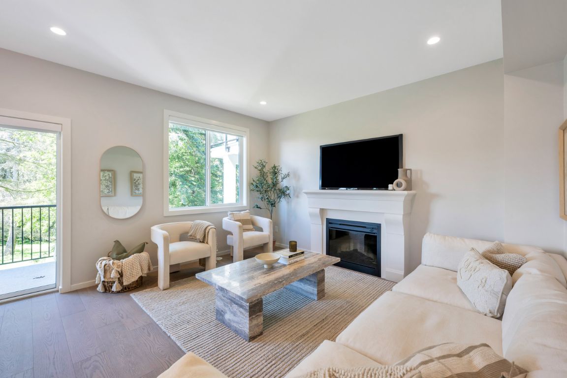 http://fox%20and%20aikins%20south%20living%20room%20with%20fireplace%20and%20tv%20and%20ceiling%20high%20windows